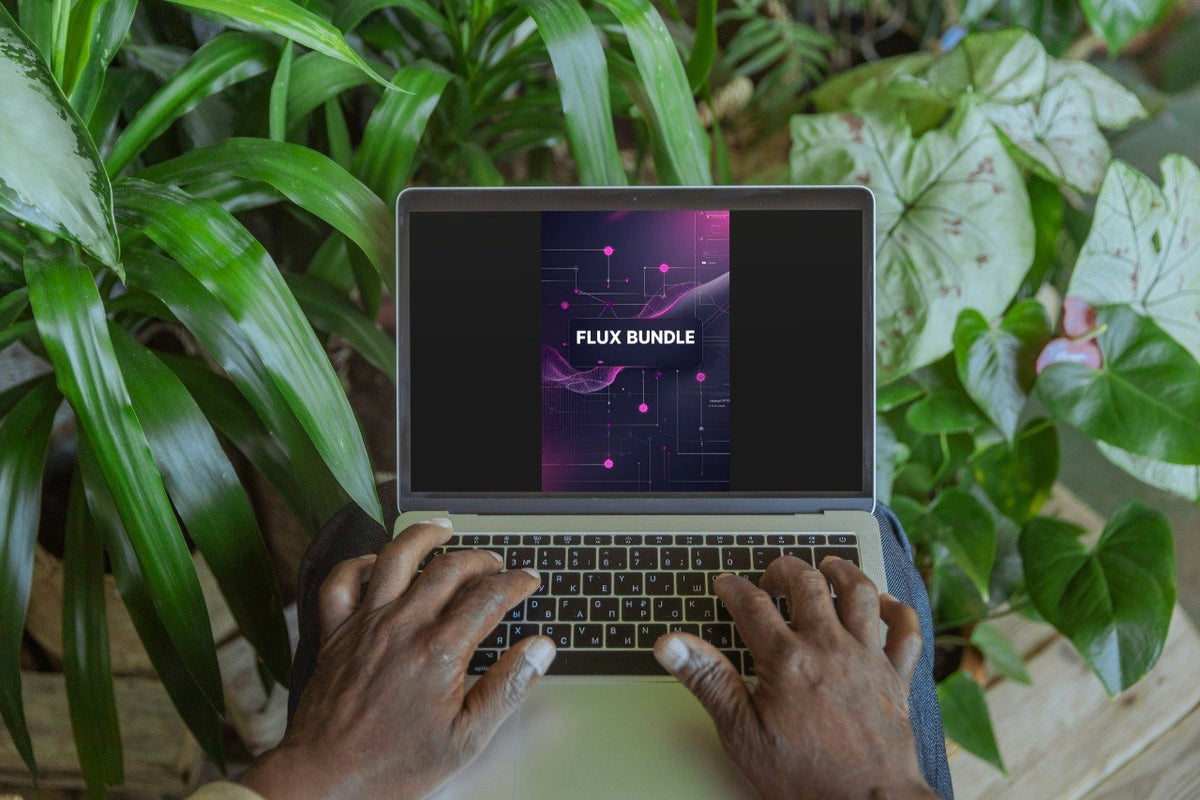 A top-down view of a person typing on a laptop surrounded by lush green plants. The laptop screen displays a digital graphic with the text 'FLUX BUNDLE' on a dark purple and pink abstract background.